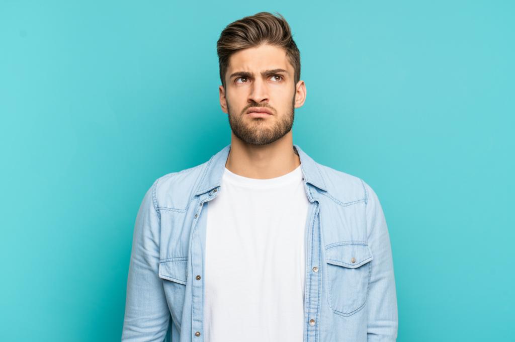 young man looking frustrated and disappointed
