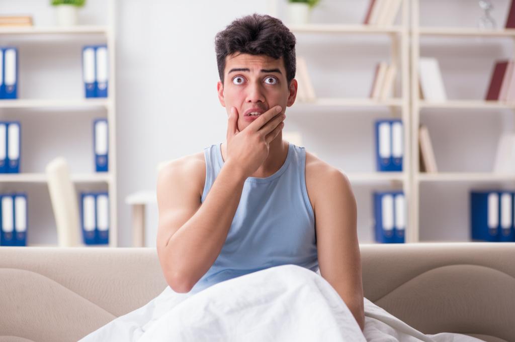 young man feeling tired and low energy after staying up late