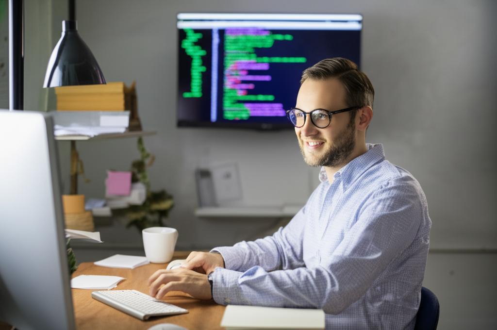 Happy programmer working efficiently